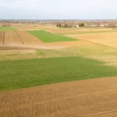 Aerial view of farmland in Fayette and Clinton counties, Ohio, showcasing fertile fields ideal for solar farm development, sustainable agriculture, and renewable energy growth.