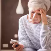 concerned woman looking at phone